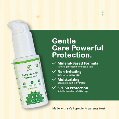 Baby mineral sunscreen bottle with green label on a beige background